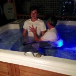 James Hansen being baptised