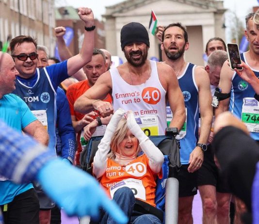 Colin Farrell runs the Dublin Marathon’s last stretch, pushing friend Emma Fogarty with EB, while Moses Kemei and Asmirach Nega win the races.