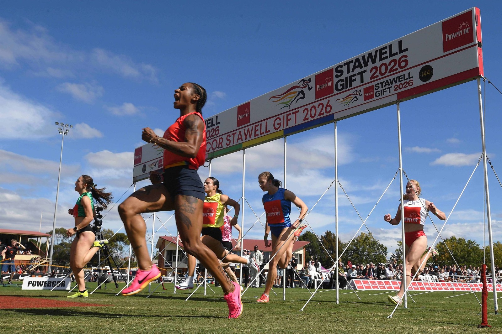 Shakari Richardson celebrates winning the Women's Stawell Gift Award